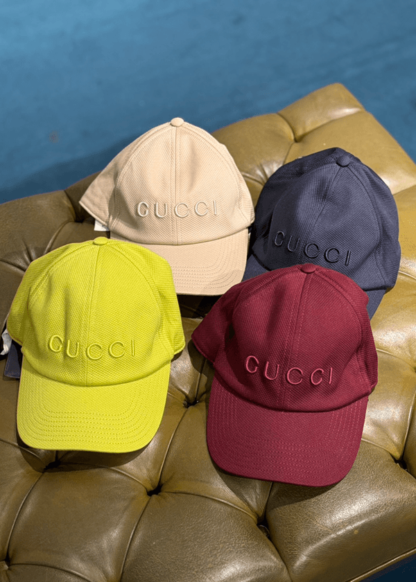 Editorial fashion styling with statement headwear.